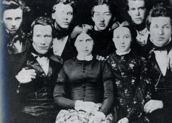 6 young men and 2 woman sitting for a portrait