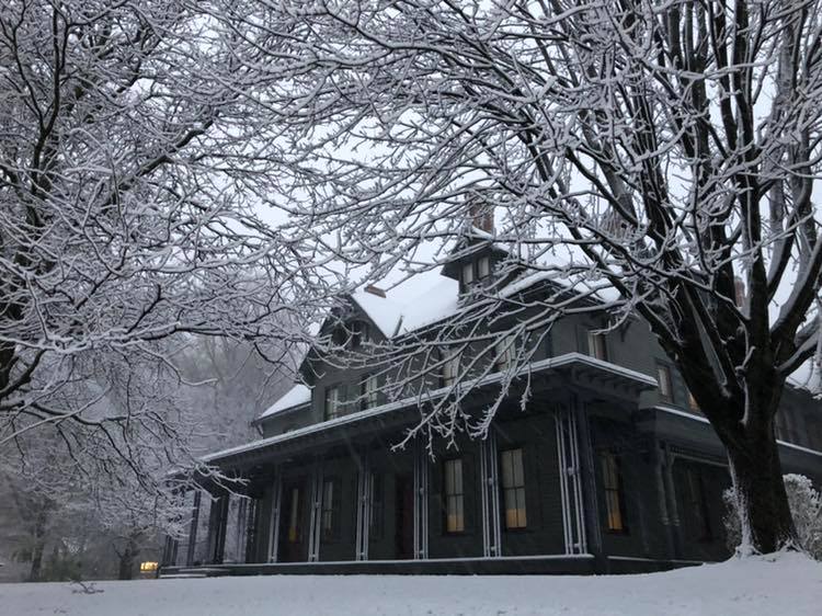 Snow covers a large house