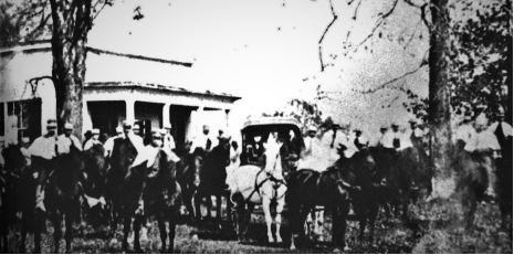 a group of people in front of the house