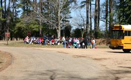 Students eating lunch at the picnic tables next to the Bus parking area at Historic Jamestown