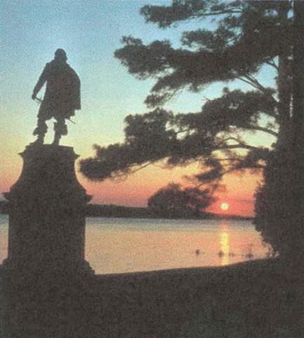 statue of Captain John Smith (located on Jamestown Island) in the sunset