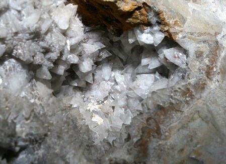 Sharp pointed crystals in a hole in limestone.