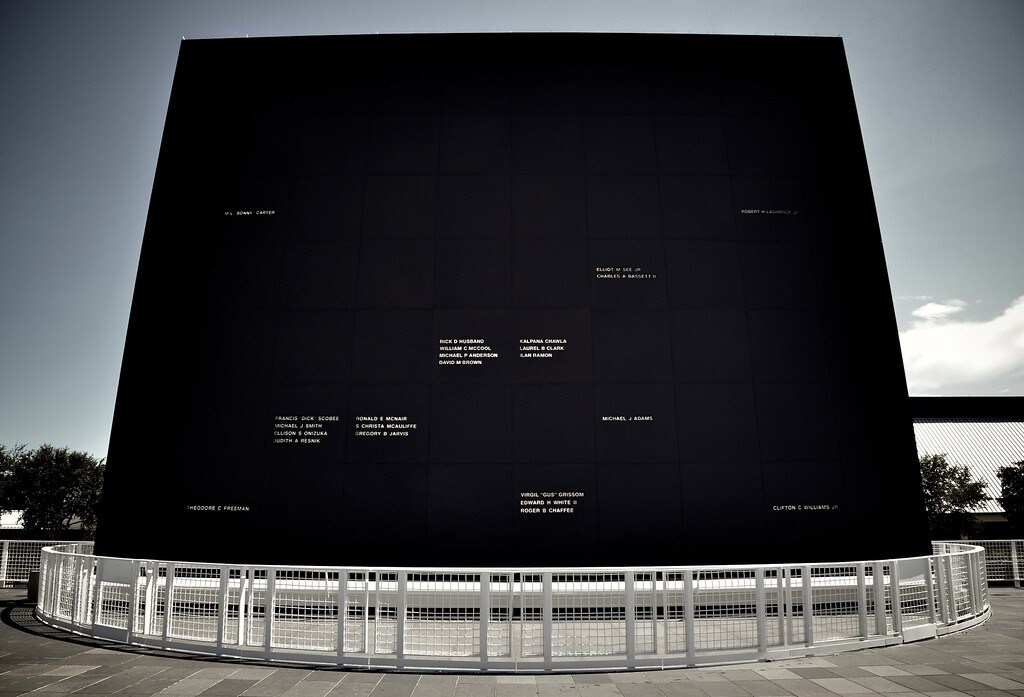 Very large black granite stone, angled to reflect the sun’s rays.  White lettering includes the names of twenty-five astronauts who have died as of result of American space activities.