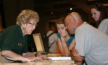 volunteer working info desk