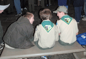 three boy scouts sit on bench in rotunda of Old Courthouse during scout workshop