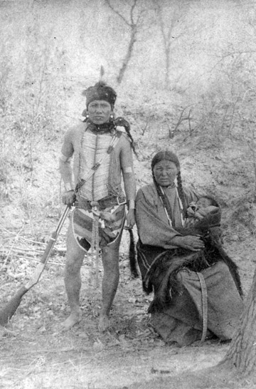 American Indian man and woman with a baby. V101-000012