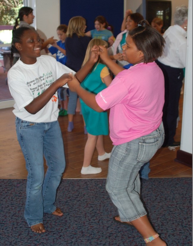 ACC Girl Scouts dancing Girls learn to Cajun dance