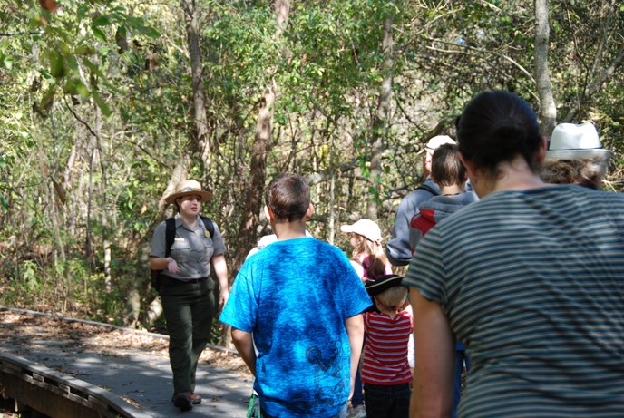 Image of park ranger talking to visitors