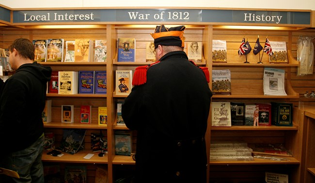 Man dressed as War of 1812 soldier shops in park store Man dressed as War of 1812 soldier shops in park store