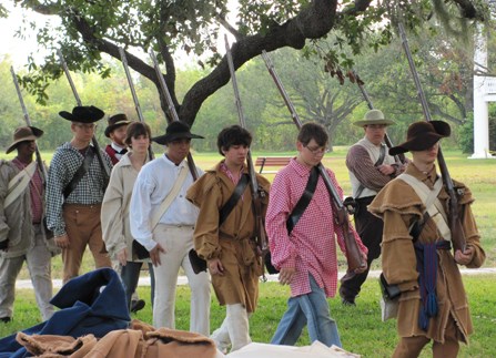 Image of high school students in 1815 period dress practicing military drills
