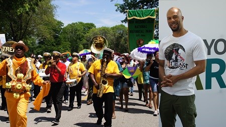 A brass band and costumed performers with umbrellas march in a parade, and an image of the artist Common.