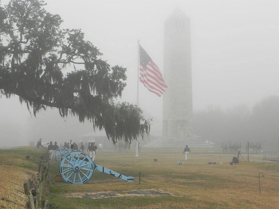 Foggy Battlefield - Main Screen - 960 pixels Cannons, an American flag, and Chalmette Monument in the fog