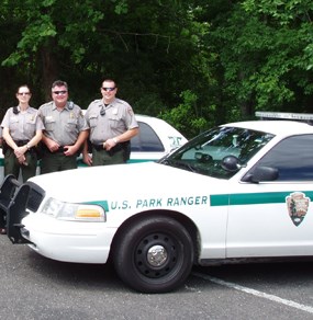 Law enforcement rangers and their car Law enforcement rangers and their car