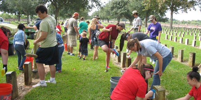 Image of volunteers cleaning headstones at Chalmette National Cemetery Image of volunteers cleaning headstones at Chalmette National Cemetery