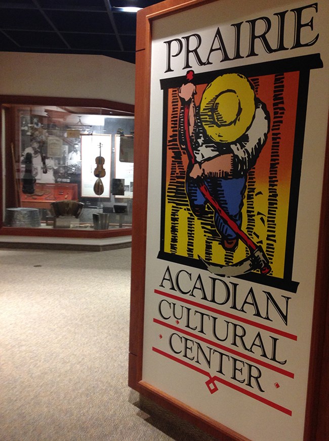 Entry to Prairie Acadian Cultural Center with logo and exhibits Entry to Prairie Acadian Cultural Center with logo and exhibits