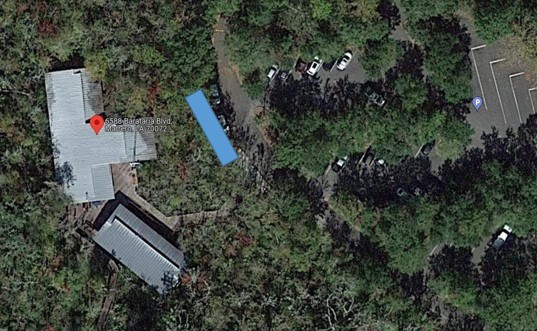 A satellite image showing a blue rectangle area in the bus parking area outside of the Barataria Preserve Visitor Center in Marrero, LA.