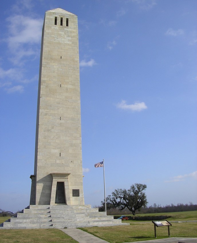 Image of Chalmette Monument with American flag flying in background