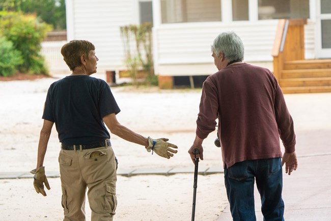 A volunteer talks with a visitor at the Boyhood Home.