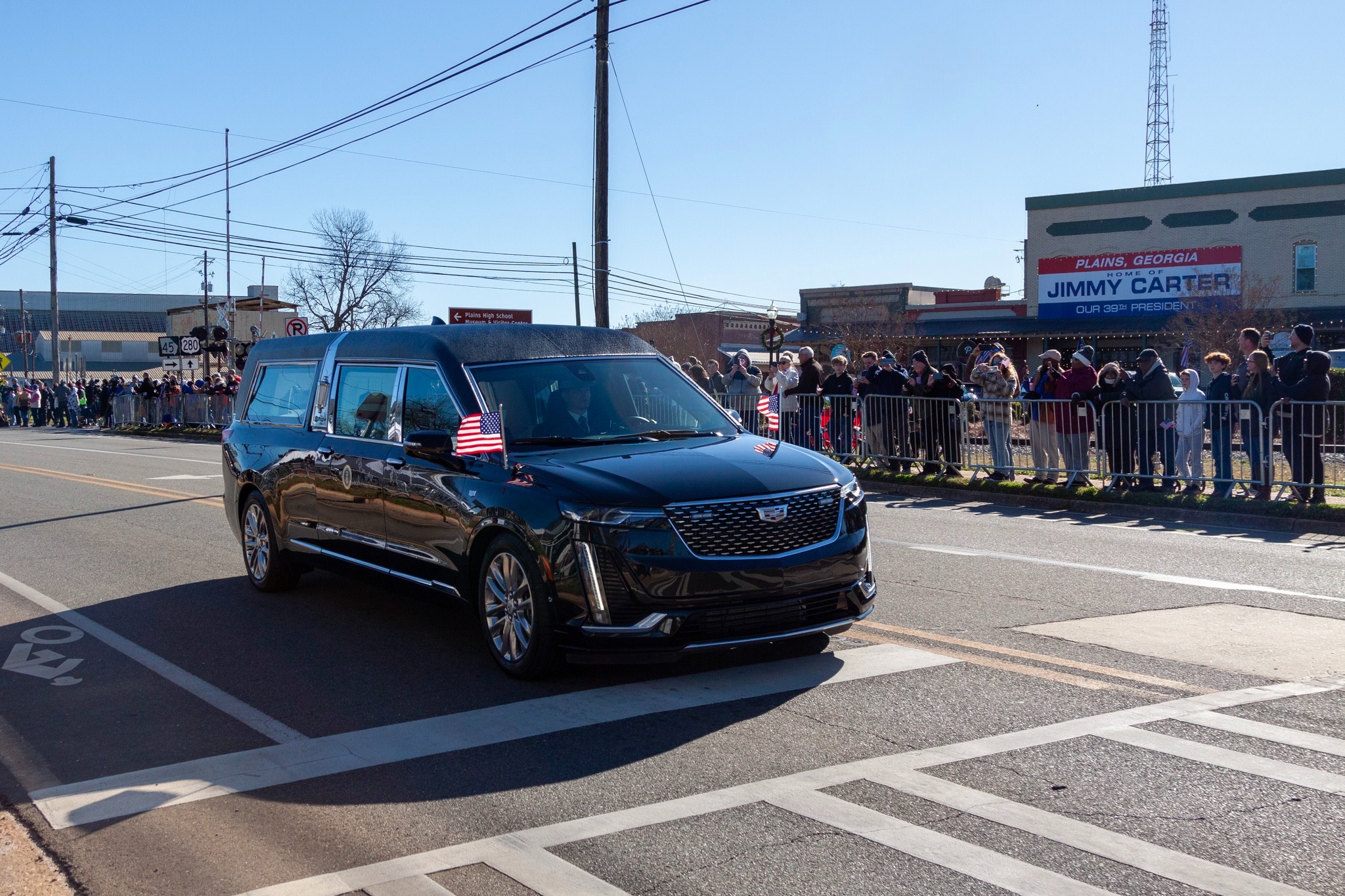 hearse Hearse passing a crowd of people