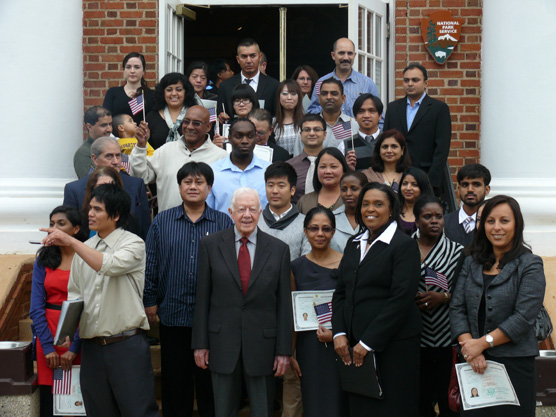 President Carter with new citizens.