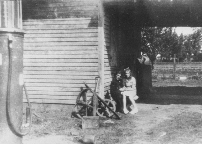 Lillian and her daughter, Gloria, in front of the Carter store