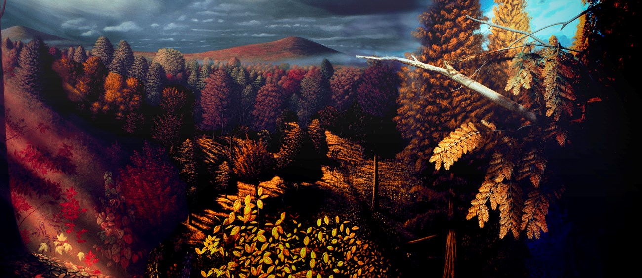 Bridge Creek Flora mural shows an autumn day with various deciduous trees with leaves that are yellow, red, and tan. A volcano looms in the foreground with stormy skies above.