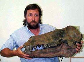 Image of Paleontologist Ted Fremd holding an Entelodont skull.
