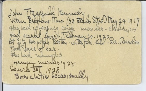 Handwritten, cursive notes in dark ink on a beige paper note card.