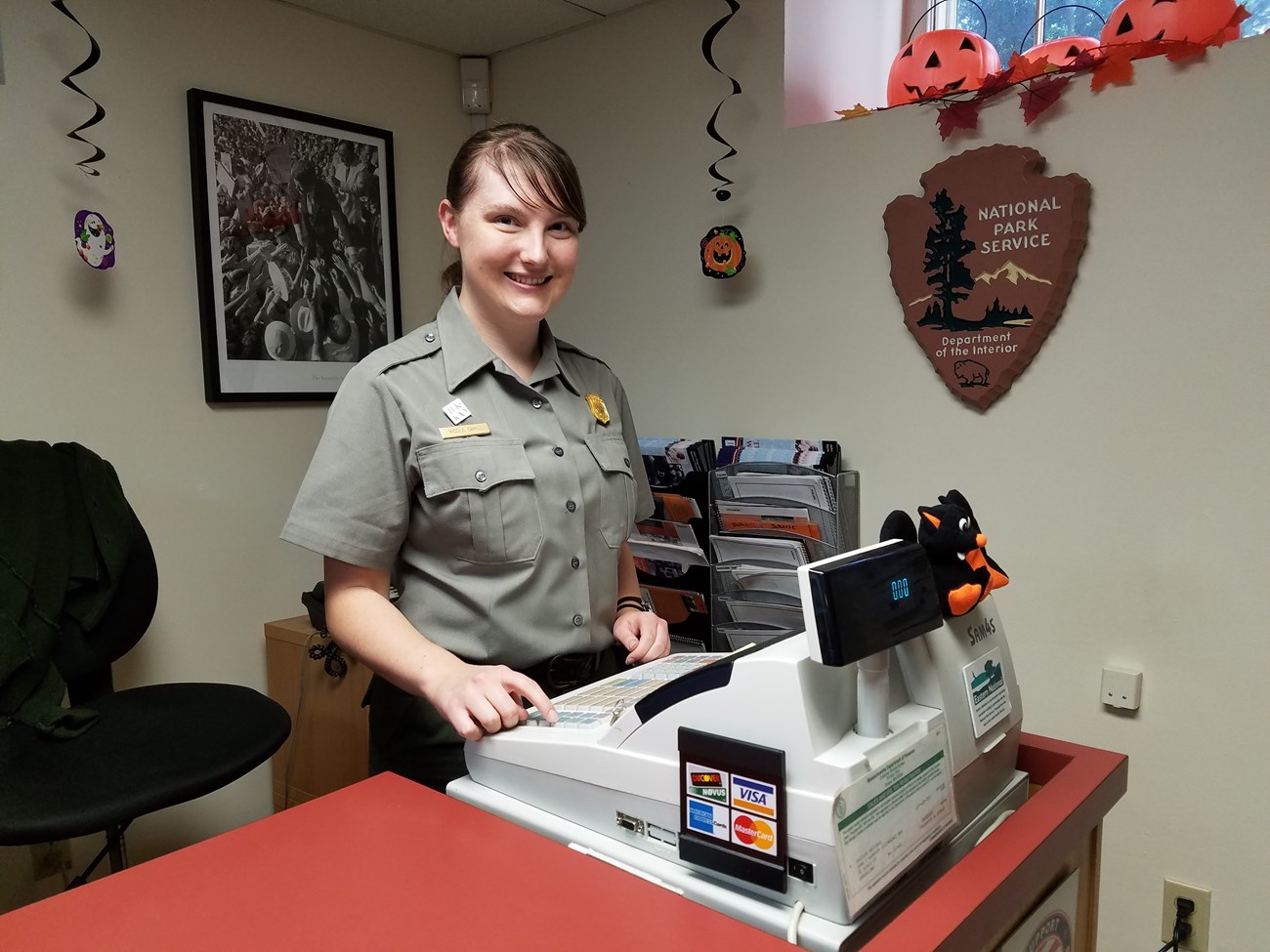 Ranger Nicole runs the register.