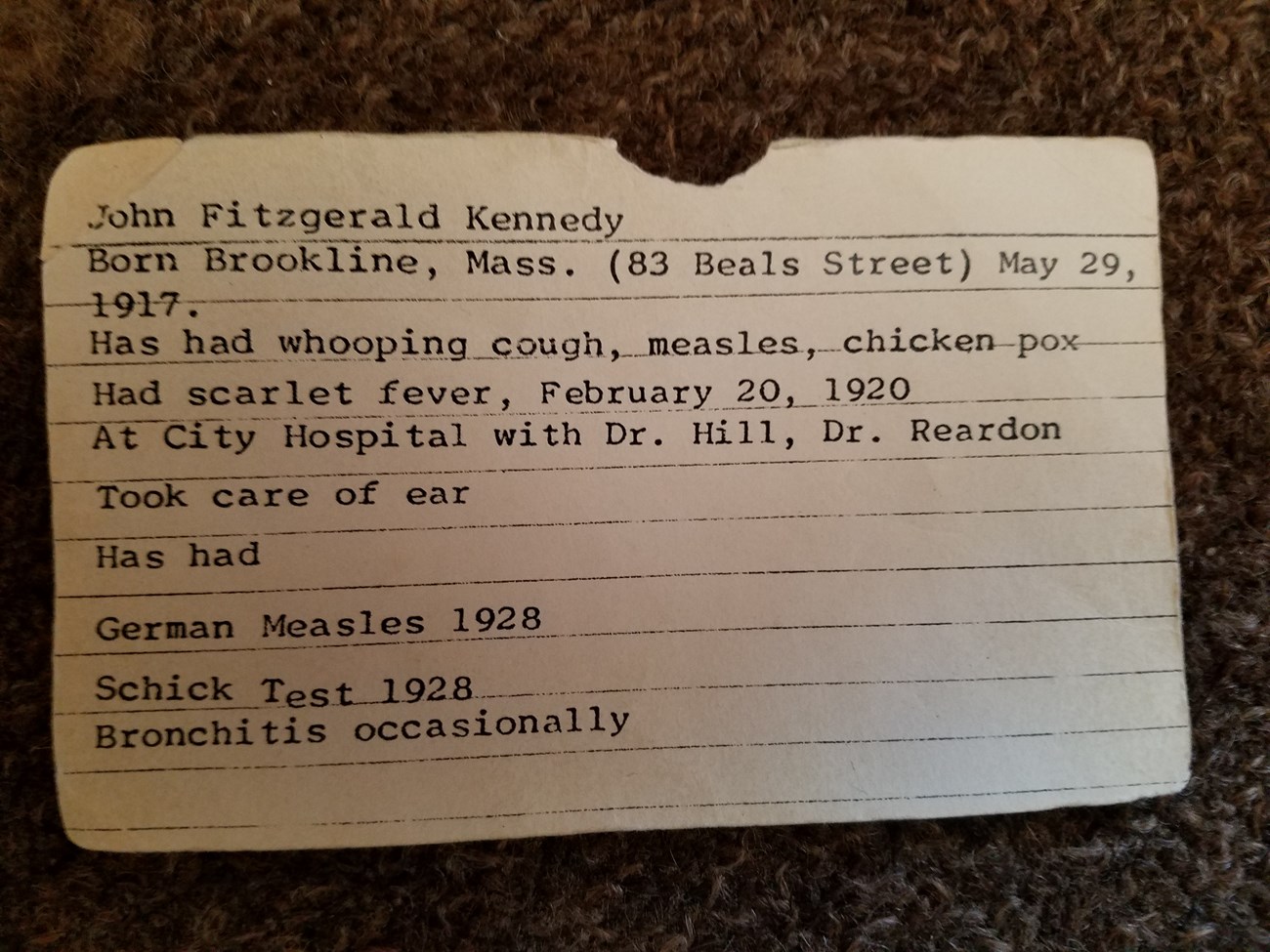 JFK's health card, listing a variety of childhood ailments.