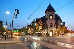 Coolidge Corner at night; buildings are lit, the moon is visable Coolidge Corner at night; buildings are lit, the moon is visable