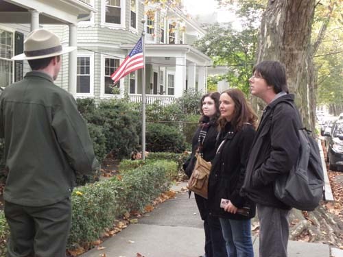 a park ranger explains to visitors how to keep themselves safe in our neighborhood.