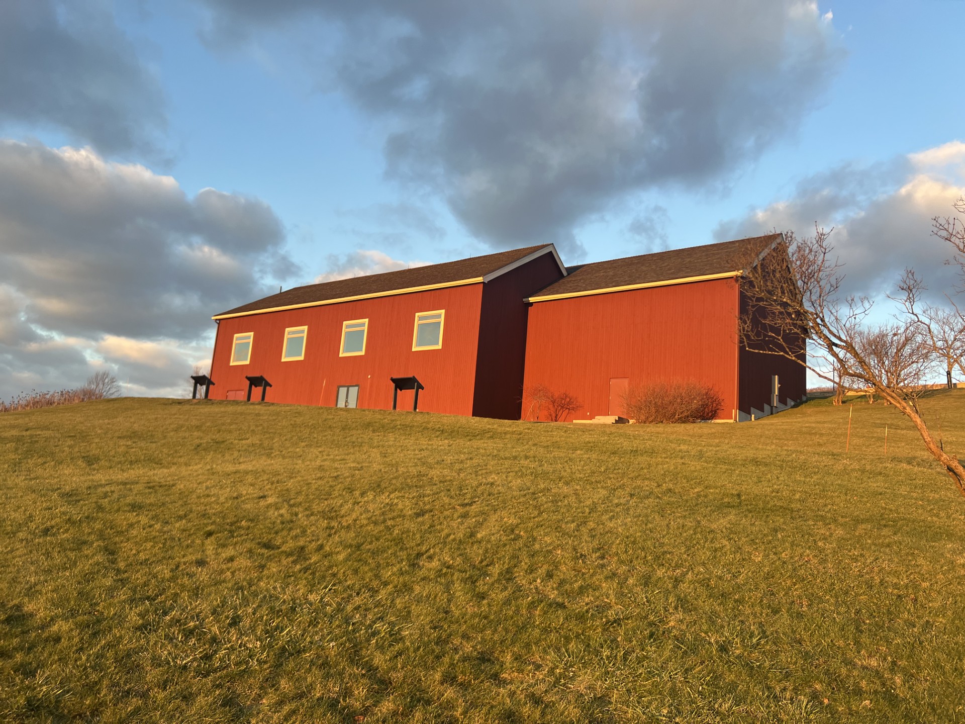 A red barn on a hill