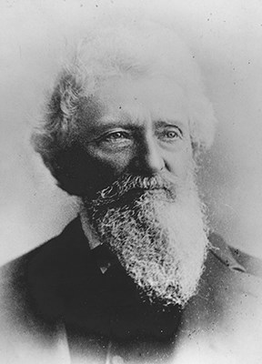 Black-and-white portrait of Dr. John Strentzel, father-in-law of John Muir, with a full beard and a composed expression, dressed in a suit and looking slightly to the side.