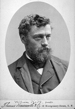 Historic photograph of Willaim Keith. Man with a beard, wearing a suite, poses for the camera.
