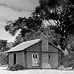 Black and white photo of the Oasis of Mara cabin.