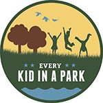 circular graphic showing kids playing in a field and the words EVERY KID IN A PARK circular graphic showing kids playing in a field and the words EVERY KID IN A PARK