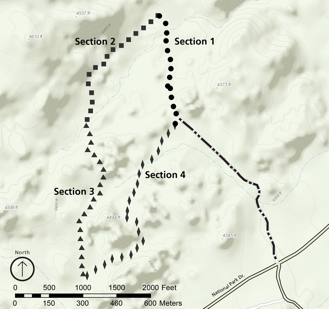 Map of the Split Rock area. The trail makes a loop, with a spur that goes to the road. Starting from where the spur meets the loop, at approximately 3 o'clock on a clock face, the trail moves counter-clockwise through sections 1-4, each 1/4 of the total.