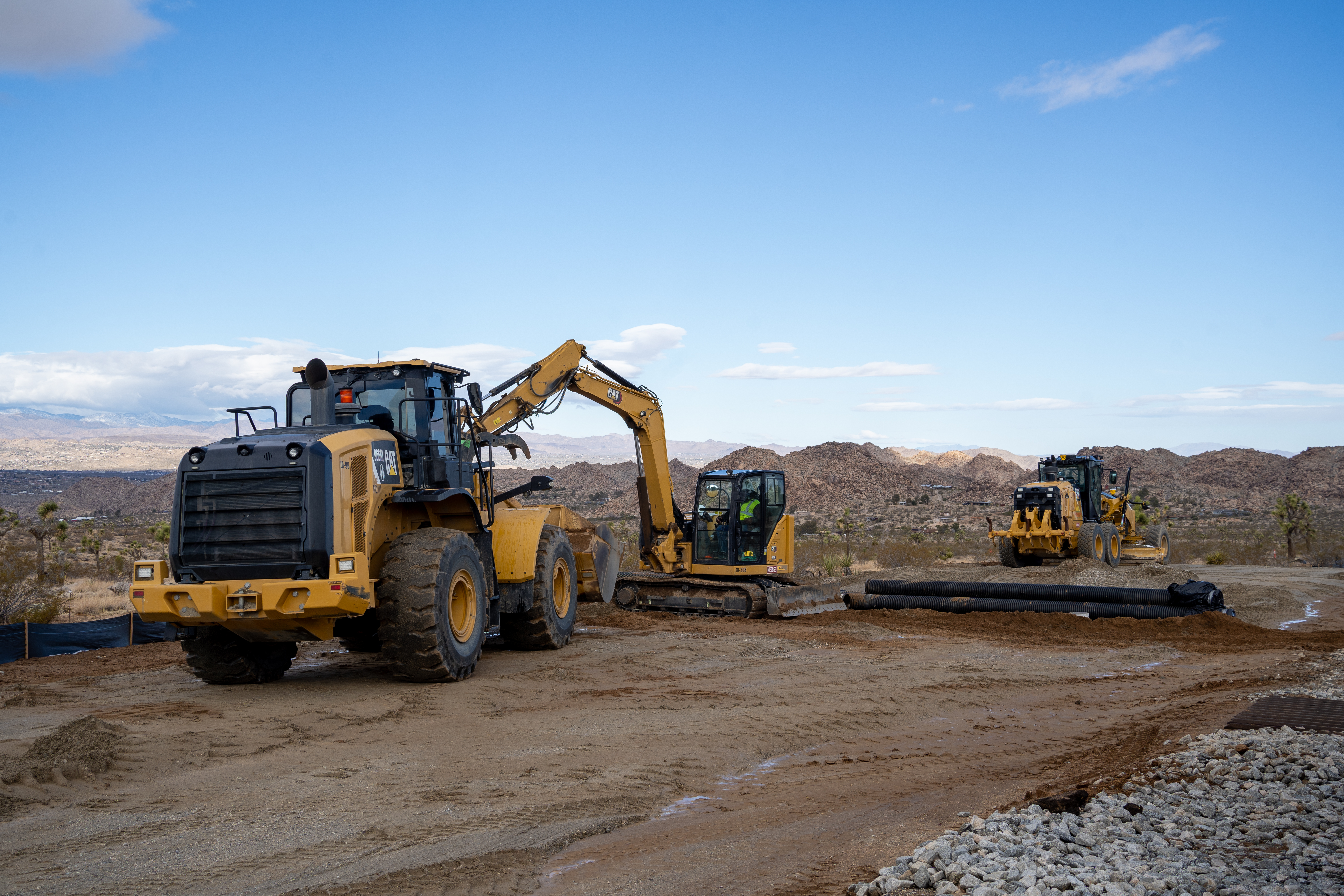 West Entrance Construction Status Three large construction machines at West Entrance Construction site
