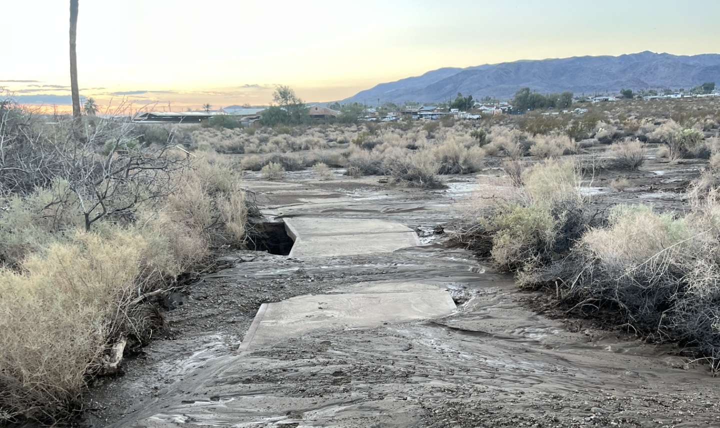 A walking path with mud and debris