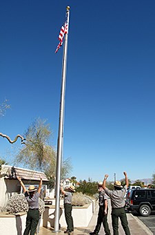 Raising the American flag at Oasis Visitor Center as the park reopens.