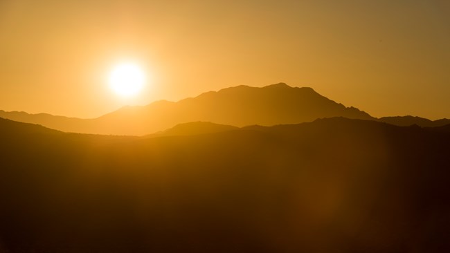 Bright Sun over mountian peaks