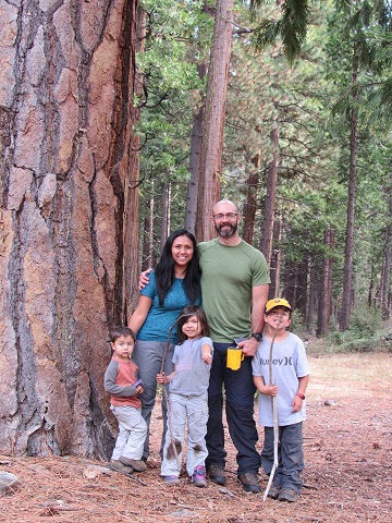 Melissa Avery and her Family in El Dorado National Forest. From left to right: David, Melissa, Sophia, Jesse, and Diego Avery. Two adults and three children standing in a forest.