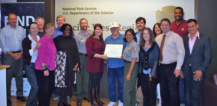 A group of men and women posing with the Department of Interior Citizen's Award for Exceptional Service.