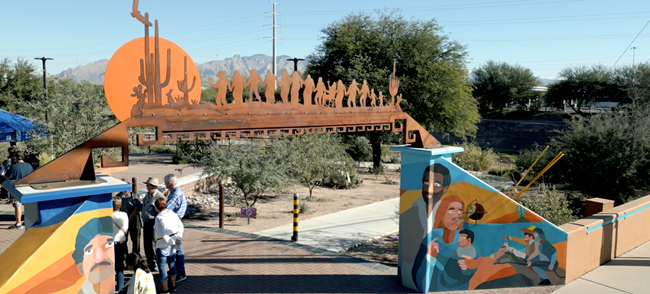 A brightly colored mural lines the archway of the Cultural History Park