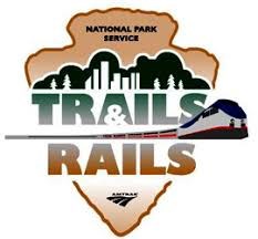 Logo for the Trails and Rails program, NPS arrowhead and amtrak