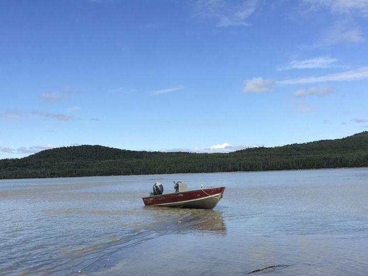 Boat stuck on sand bar Boat, center, stuck on sand bar
