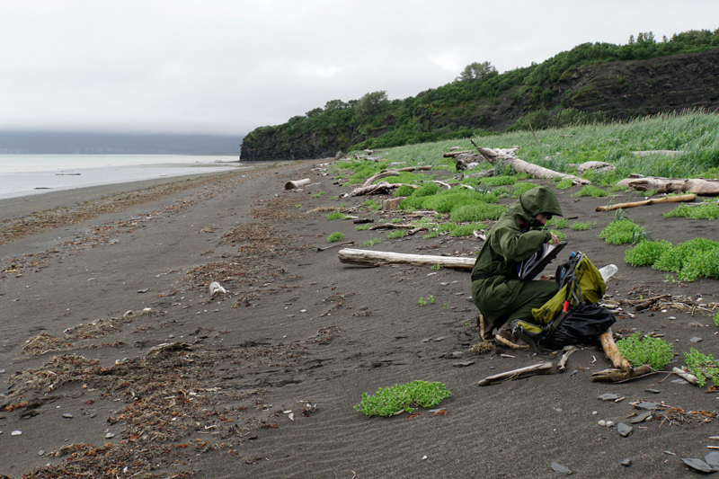 A ranger retrieves gear from a backpack