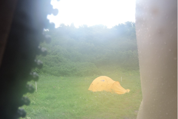 View out of a tent into wet weather