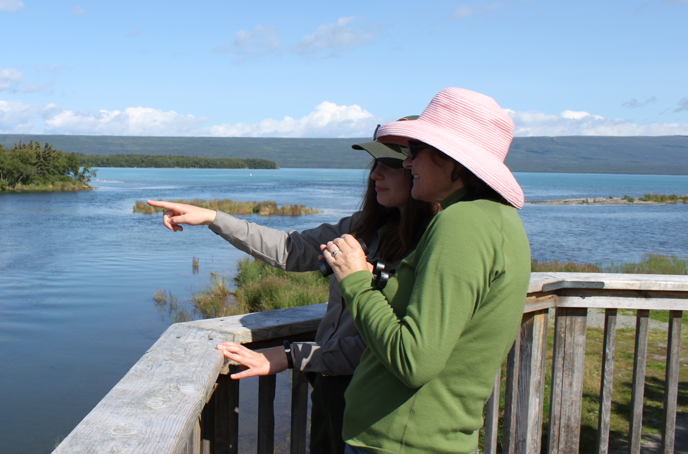 ranger on wildlife viewing platform with visitor